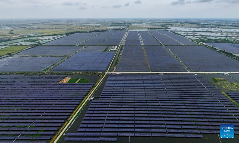 An aerial drone photo taken on May 21, 2024 shows a photovoltaic power project in Yangzhou, east China's Jiangsu Province. In recent years, the city of Yangzhou has been boosting the construction of clean energy projects to promote the green development.(Photo: Xinhua)