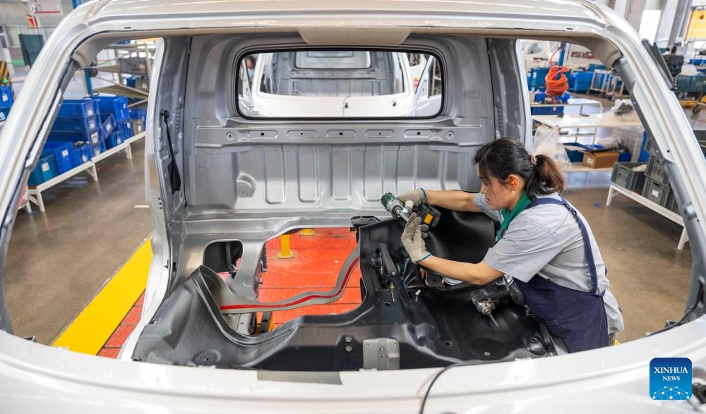 A staff member operates at an assembly line at Wuzheng Group in Wulian County, Rizhao City, east China's Shandong Province, May 23, 2024. Boasting a history dating back to 1961, Wuzheng Group has grown into an important player in China's agricultural and commercial vehicle industry, with about 10,000 staff members and total assets worthing 17 billion yuan (about 2.35 billion US dollars).(Photo: Xinhua)