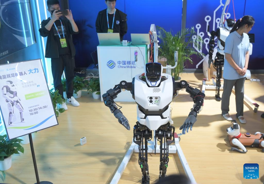 A robot practices Taichi at the on-site experience area for the 7th Digital China Summit in Fuzhou, southeast China's Fujian Province, May 23, 2024. The 7th Digital China Summit will take place in Fuzhou from May 24 to 25. The preview of its on-site experience area, covering an area of 56,000 square meters and consisting of five major parts, was opened at Fuzhou Strait International Conference and Exhibition Center on Thursday.(Photo: Xinhua)