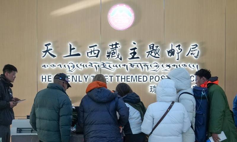 Tourists line up to buy postcards at a themed post office in a base camp of Mount Qomolangma in southwest China's Xizang Autonomous Region, May 24, 2024. The Mount Qomolangma National Park has entered peak tourism season. From Jan. 1 to May 20 this year, the Mount Qomolangma scenic spot has received about 136,000 tourists. (Photo:Xinhua)