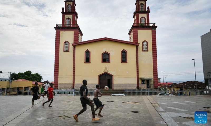 People play football at San Fernando Square in Malabo, Equatorial Guinea on May 20, 2024. Malabo is situated in the northern part of Bioko Island. The city serves as the political, commercial, financial, and cultural hub of Equatorial Guinea. It is also a major aviation hub and an important seaport of the country. (Photo: Xinhua)