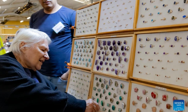 A person selects jewellery at the 2024 Canberra Winter Gemcraft and Mineral Show at the Exhibition Park in Canberra, Australia, May 25, 2024. (Photo:Xinhua)