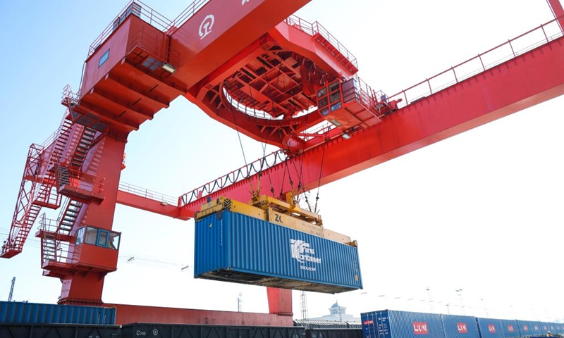 A gantry crane operates on a China-Europe freight train at a container payload swtiching yard of Suifenhe Railway Port in northeast China's Heilongjiang Province, May 25, 2024. Suifenhe Railway Port is an important port for the operation of China-Europe freight trains in northeast China. Staff members here are trying their best to reduce the average time for loading and grouping of these trains. (Photo:Xinhua)