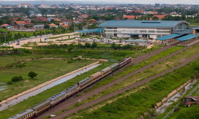 An aerial drone photo taken on July 20, 2024 shows the first Laos-Thailand cross-border passenger train arriving at Khamsavath railway station in Vientiane, Laos. The Laos-Thailand cross-border passenger train has officially started operation, running between Krung Thep Aphiwat Central station in the Thai capital of Bangkok and Khamsavath railway station in Lao capital Vientiane. (Photo by Kaikeo Saiyasane/Xinhua)