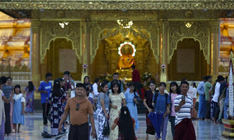 People visit the Botahtaung Pagoda during celebrations of the full moon day of Warso in Yangon, Myanmar, July 20, 2024. (Photo by Myo Kyaw Soe/Xinhua)