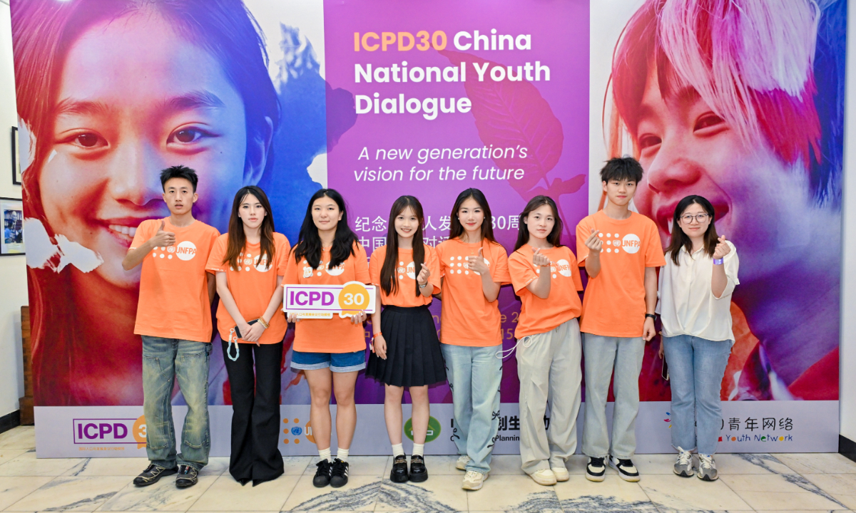 Delegates pose for a group photo at a national youth dialogue in Beijing on June 15, 2024. Photo: Courtesy of the United Nations Populations Fund (UNFPA) in China