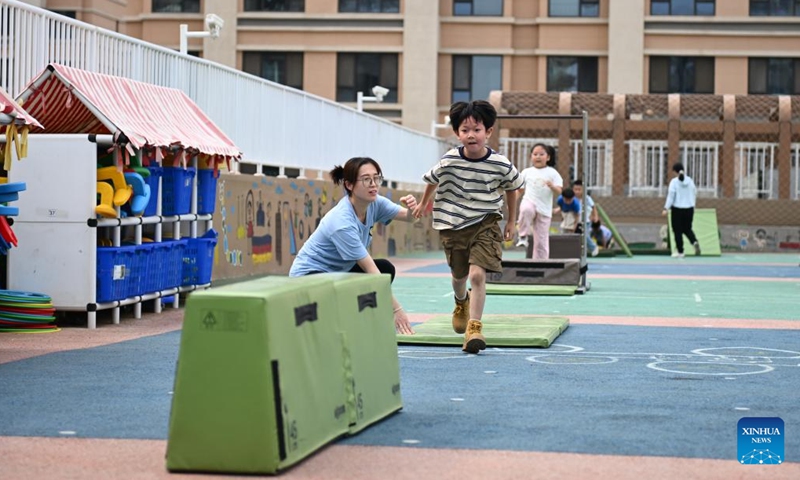 Students participate in outdoor activities at a kindergarten in Xiong'an New Area, north China's Hebei Province, May 23, 2024. (Photo: Xinhua)