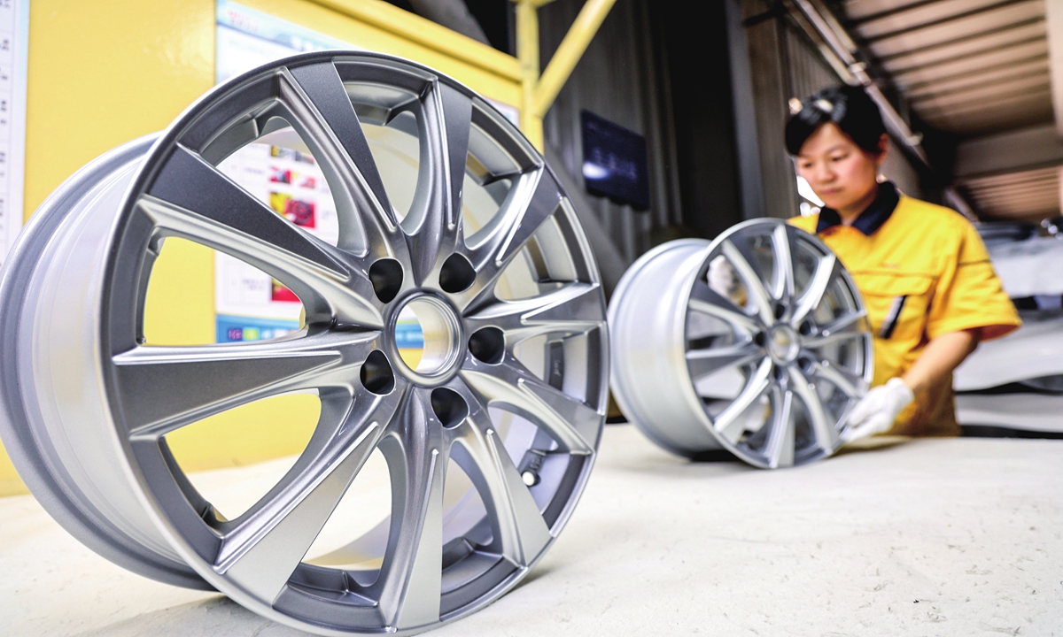 A staff member makes automobile wheels at a workshop in Binzhou, East China's Shandong Province on May 27, 2024. Binzhou has been vigorously developing the auto parts industry with a focus on wheels, and it has established long-term and stable cooperative relations with a number of leading global brands. Photo: VCG