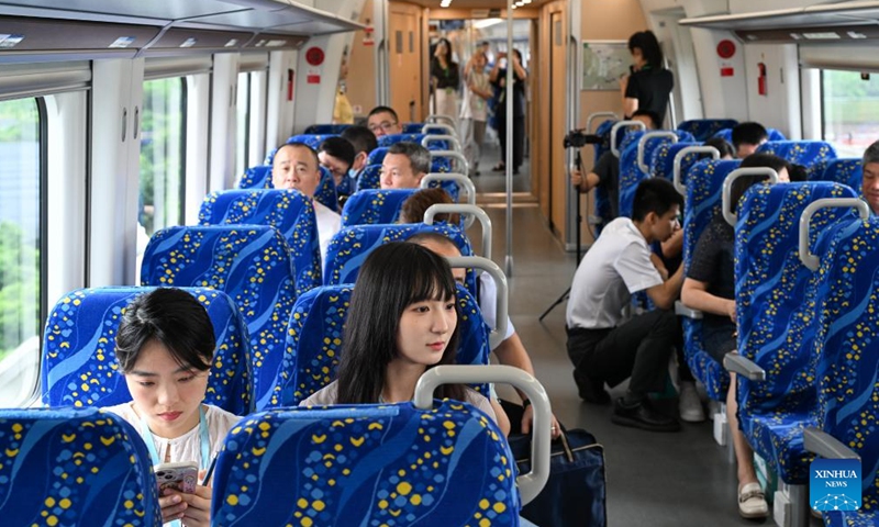 Passengers are seen on the first train of the intercity railway from Foshan to Dongguan in south China's Guangdong Province, May 26, 2024. (Photo: Xinhua)