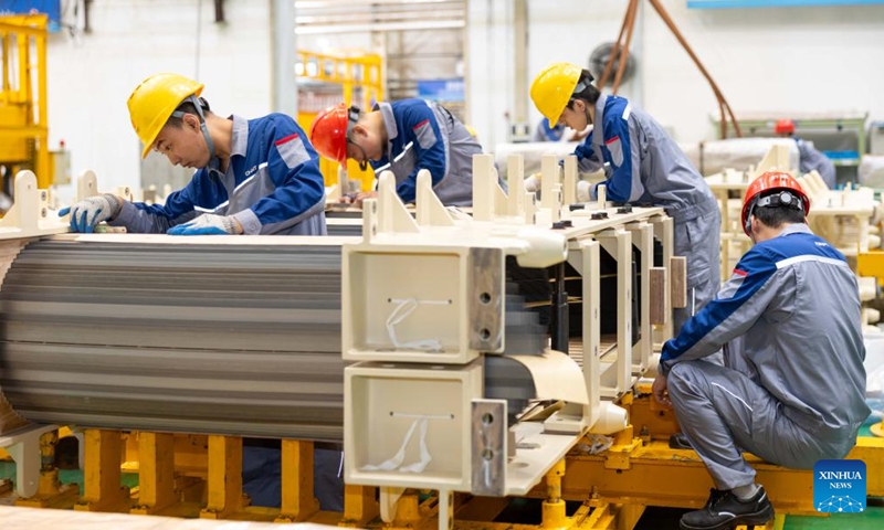 Staff members work at a factory of CHINT Group in Songjiang District of east China's Shanghai, May 23, 2024. (Photo: Xinhua)