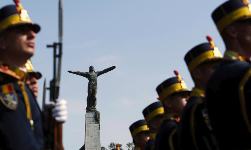 Soldiers attend celebrations of the Romanian Aviation and Air Force Day in front of the Statue of Air Heroes in Bucharest, Romania, July 20, 2024. (Photo by Cristian Cristel/Xinhua)