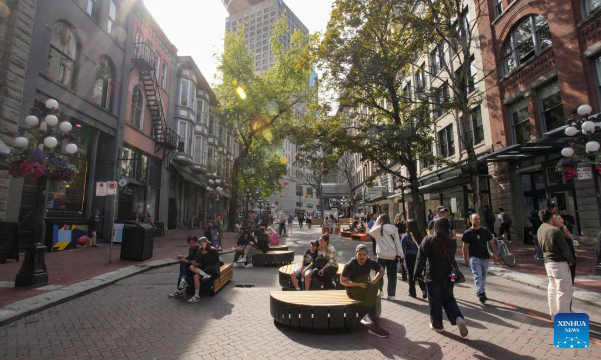 Visitors enjoy their day on a street in Gastown, which has turned into a pedestrian zone, in Vancouver, British Columbia, Canada, June 28, 2024. (Photo: Xinhua)