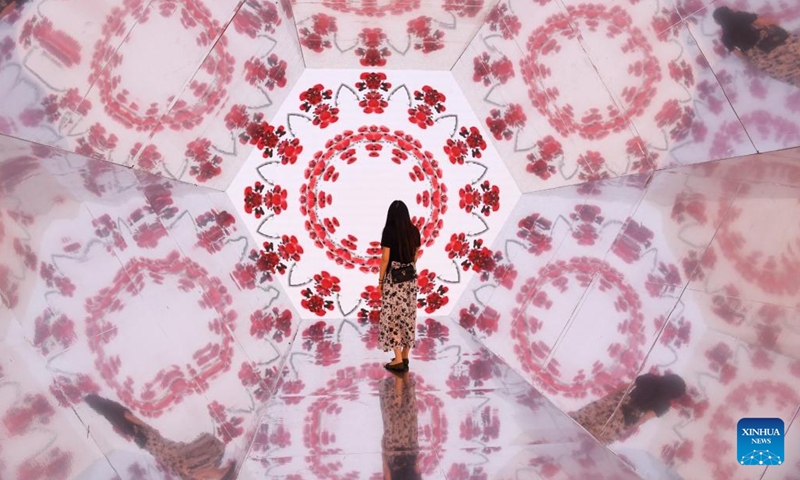 A woman visits an installation during the 20th China (Shenzhen) International Cultural Industries Fair (ICIF) in Shenzhen, south China's Guangdong Province, May 24, 2024. The 20th ICIF opened on Thursday in the southern Chinese metropolis of Shenzhen. The fair will showcase new business forms and new applications through the combination of multimedia such as AI and AR. (Photo: Xinhua)