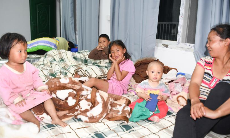 People rest at Xinhua primary school in Malie Township, Hanyuan County, Ya'an City, southwest China's Sichuan Province, July 20, 2024. (Xinhua/Wang Xi)