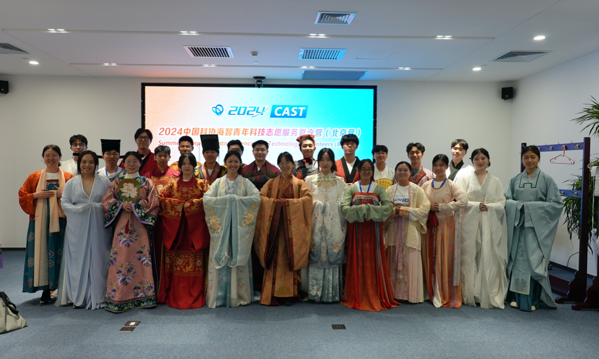Participants wearing traditional Chinese costume pose for a group photo on July 1, 2024. Photo: Courtesy of CAST