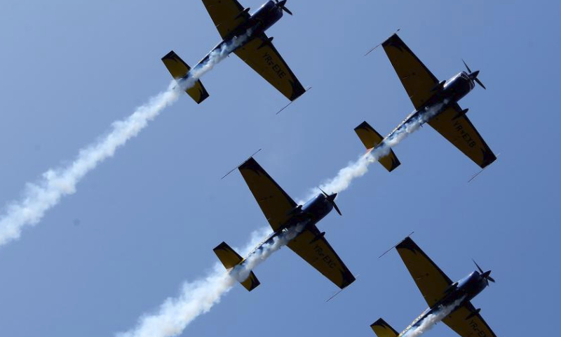 Aerobatic airplanes perform during celebrations of the Romanian Aviation and Air Force Day in Bucharest, Romania, July 20, 2024. (Photo by Cristian Cristel/Xinhua)