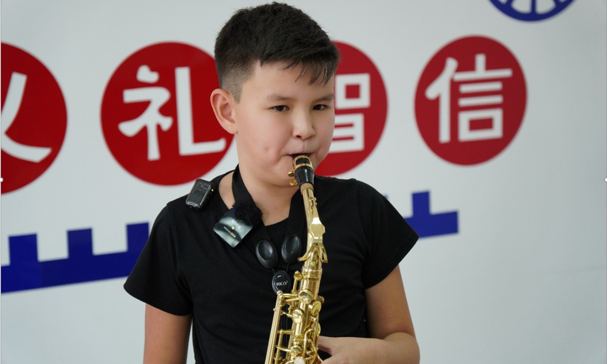 Kanatov Amirkhan Yerlanovich, a 10-year-old boy from Kazakhstan plays the saxophone. Photo: Wang Pu/Global Times 