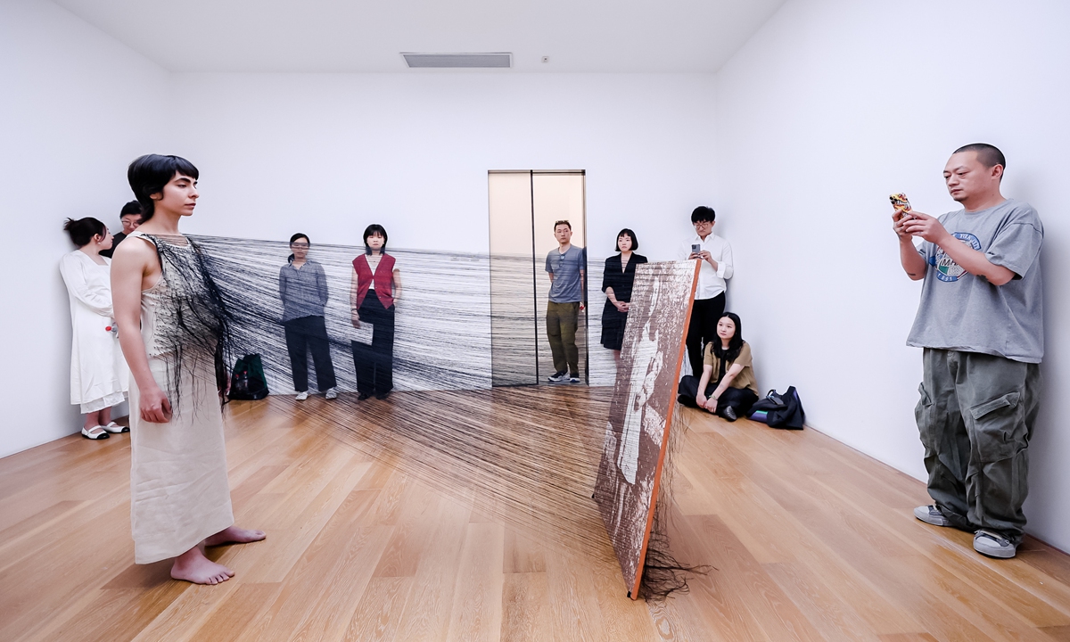 Visitors experience an artwork. Photo: Courtesy of Gallery Weekend Beijing