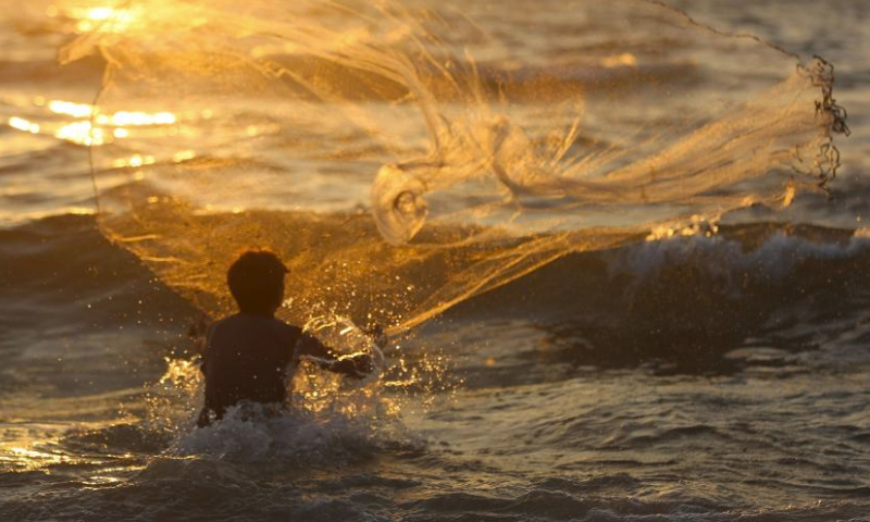 A man fishes at seaside during hot weather in the city of Deir al-Balah, central Gaza Strip, on July 19, 2024. (Photo by Marwan Dawood/Xinhua)