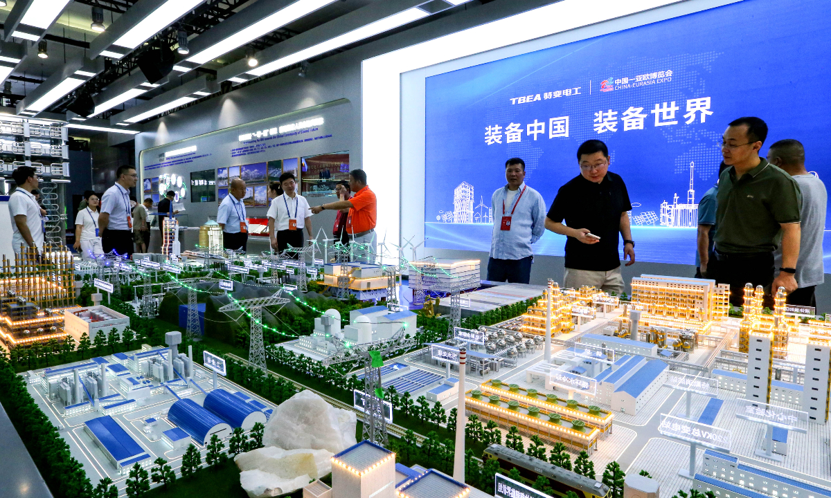 Visitors watch an intelligent mine model of the TBEA displayed at the Xinjiang International Convention and Exhibition Center during the 8th China-Eurasia Expo in Urumqi, Northwest China's Xinjiang Uygur Autonomous Region, on June 27, 2024. Photo: VCG   