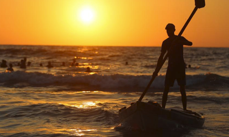 A man fishes at seaside during hot weather in the city of Deir al-Balah, central Gaza Strip, on July 19, 2024. (Photo by Marwan Dawood/Xinhua)