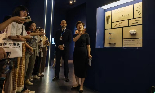 Zhu Xiaoyun, (right) director of international cooperation at the National Museum of China (NMC) co-curator of the exhibition and Bastien Varoutsikos, (second from right) strategy director of ALIPH and co-curator of the exhibition, introduce exhibits to visitors at the NMC in Beijing on June 6, 20224. Photo: Li Hao/GT