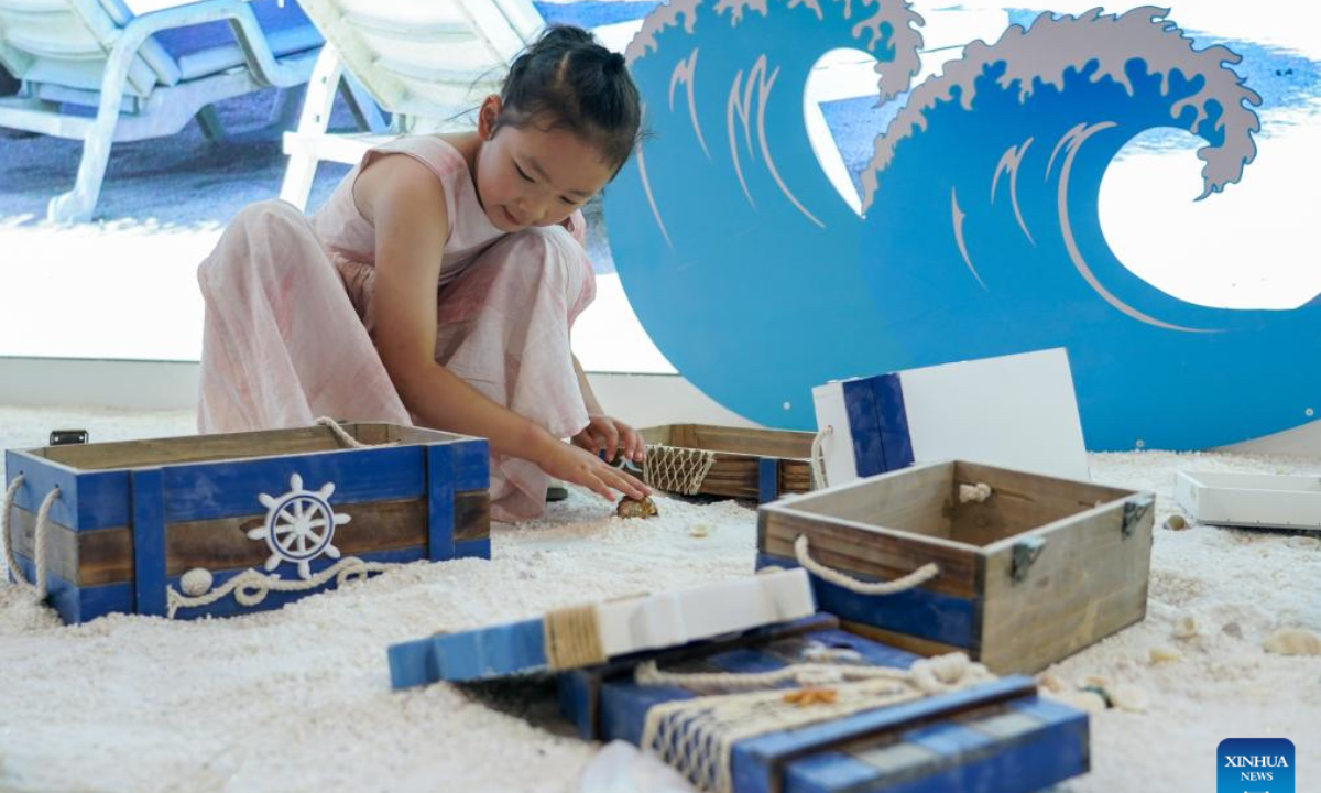 A child plays at the Maldives exhibition area of the South Asia Pavilion during the 8th China-South Asia Expo in Kunming, southwest China's Yunnan Province, July 26, 2024. The 8th China-South Asia Expo runs from July 23 to 28 in Kunming. The expo presents 15 pavilions, including two dedicated to South Asian countries, showcasing a total of approximately 800 booths. (Photo: Xinhua)