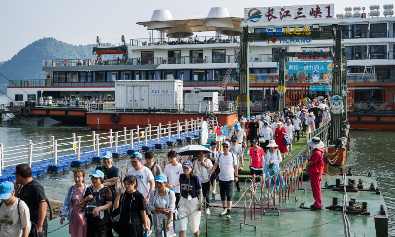 Tourists disembark from the Yangtze River Three Gorges 1, the world's largest pure electric cruise ship, at a wharf in Yichang, Central China's Hubei Province, on May 23, 2024. Photo: Chen Tao/GT