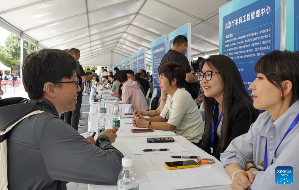 A job seeker consults during a job fair dedicated to persons with disabilities in Beijing, capital of China, May 27, 2024. By the end of 2023, the employment rate for persons with disabilities of working age in Beijing had reached 68.5 percent.(Photo: Xinhua)