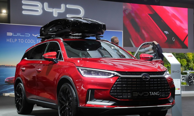 A man looks at a BYD Tang during the press day of the 100th Brussels Motor Show in Brussels, Belgium, Jan. 13, 2023. Photo:Xinhua
