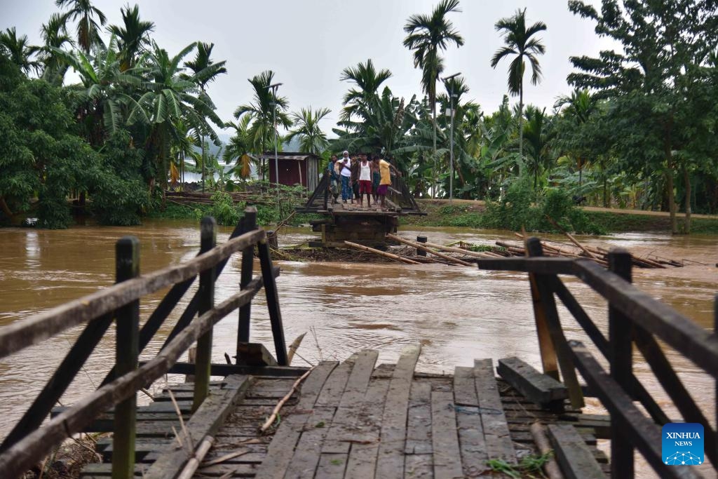 Villagers look at a destroyed bridge after heavy rains following the landfall of Cyclone Remal in Nagaon district, Assam, northeastern India, on May 29, 2024. Storms and rainfall-induced landslides triggered in the aftermath of Cyclone Remal killed at least 32 people and injured many others across India's West Bengal and four northeastern states, officials said Tuesday.(Photo: Xinhua)