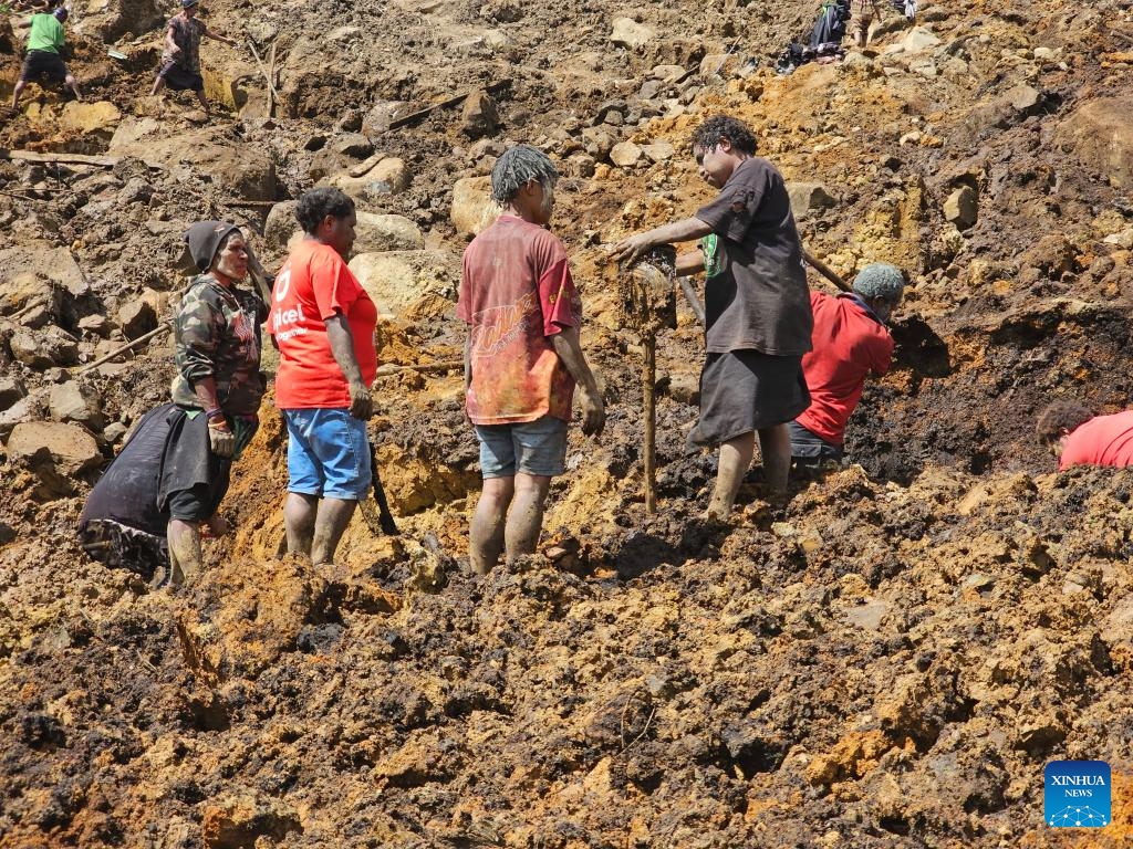 Local people search the site of a landslide in Mulitaka Village, Enga Province, Papua New Guinea, May 29, 2024. It is highly unlikely to find any more survivors from the massive landslide in Papua New Guinea (PNG)'s remote Enga Province, a UN official said on Tuesday.(Photo: Xinhua)