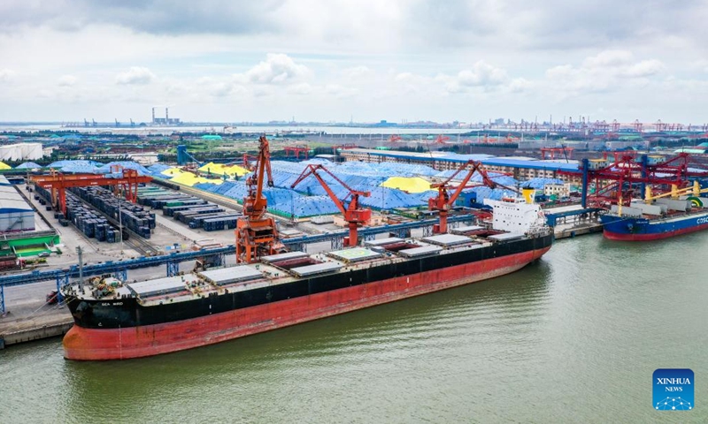 An aerial drone photo taken on May 21, 2024 shows cargo ships unloading at Fangchenggang Port in Fangchenggang, south China's Guangxi Zhuang Autonomous Region. In recent years, Guangxi has sought open, ocean-oriented development opportunities so as to make greater achievements in promoting high-quality development.(Photo: Xinhua)