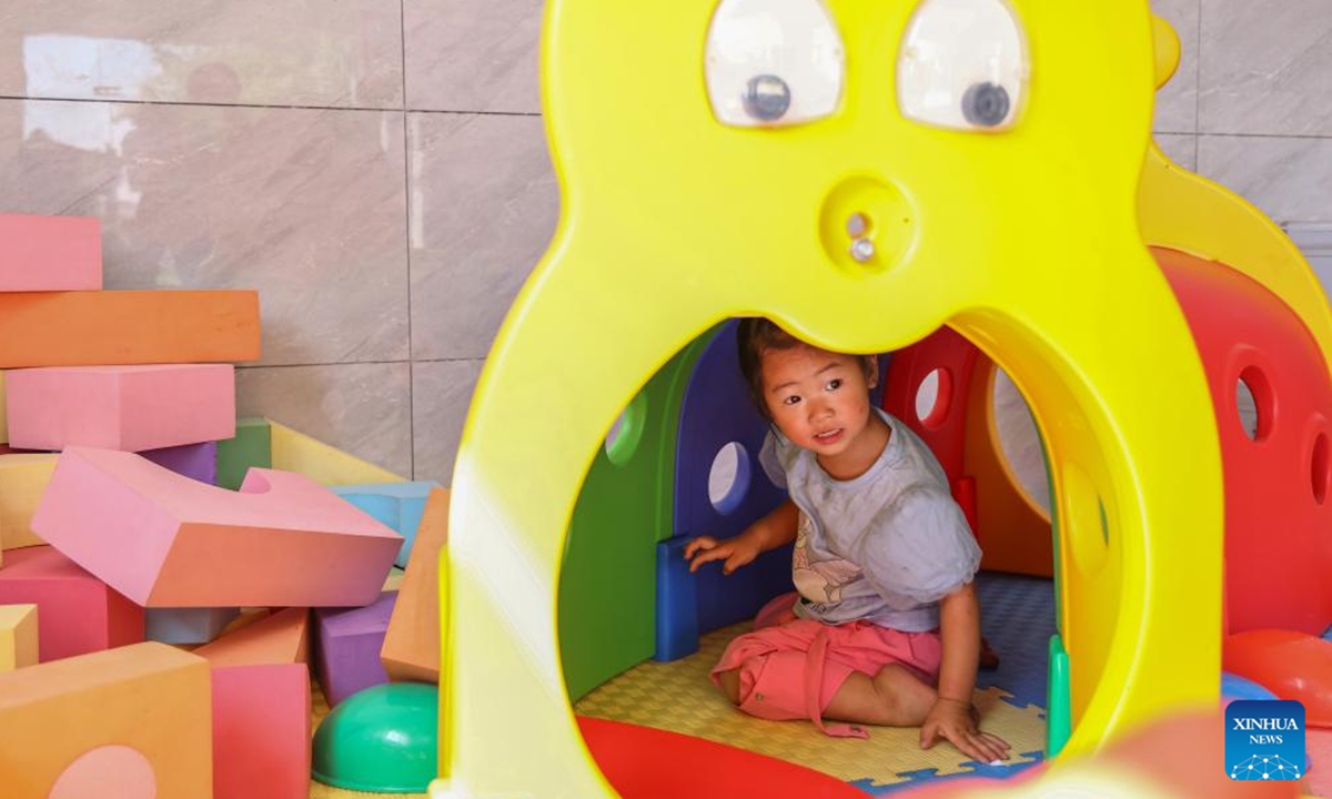 A girl plays at a Community Based Family Support (CBFS) center in Aijia Village, Yichang City of central China's Hubei Province, April 23, 2024. (Photo: Xinhua)