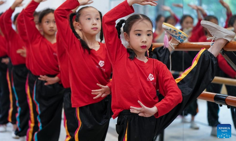 Xie Suqian (front), a pupil of the little Kunqu Opera training class, practices basic skills of Kunqu Opera with her classmates at Shipai Center Primary School of Kunshan in Kunshan City, east China's Jiangsu Province, May 30, 2024. (Photo: Xinhua)