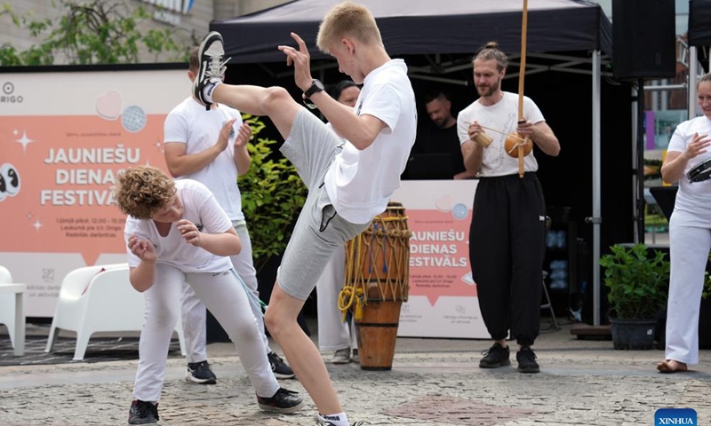 People perform capoeira during an event to mark the International Children's Day at the Dome Square in Riga, Latvia, June 1, 2024. The International Children's Day was celebrated in Riga on Saturday. (Photo: Xinhua)