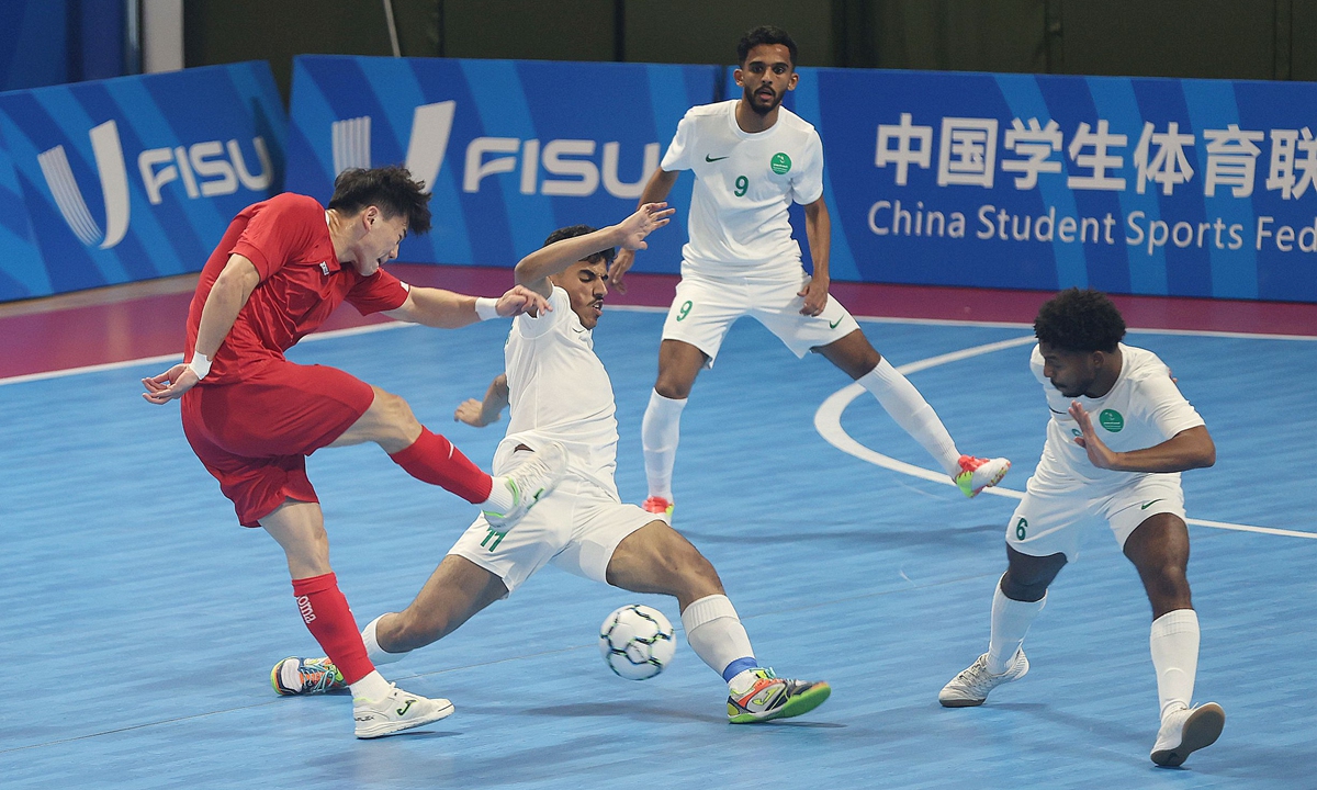 Student-athletes compete in the Shanghai 2024 FISU Futsal Championship group match between China and Saudi Arabia on June 10, 2024 in Shanghai. The match ended 3-3. A total of 285 student-athletes from all over the world are taking part in the futsal tournament that is taking place June 10-16. Photo: VCG