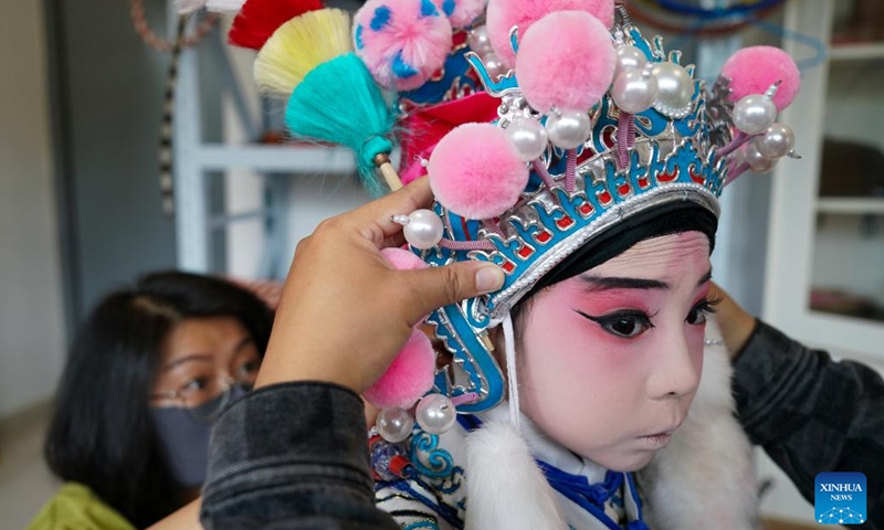 Xie Suqian, a pupil of the little Kunqu Opera training class of Shipai Center Primary School, prepares before a Kunqu Opera performance in Kunshan City, east China's Jiangsu Province, May 31, 2024. (Photo: Xinhua)