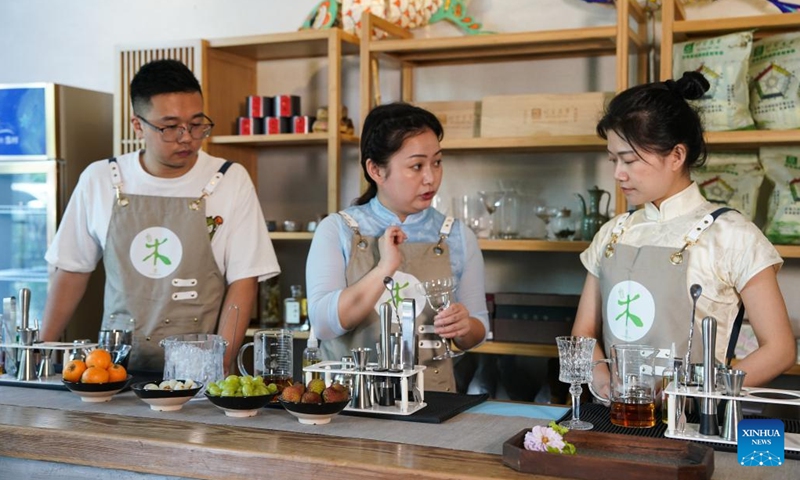 Wang Sun (C) gives instructions to her apprentices at Demingshe, a tea art vocational training school in Huangshan City, east China's Anhui Province, May 23, 2024. (Photo: Xinhua)