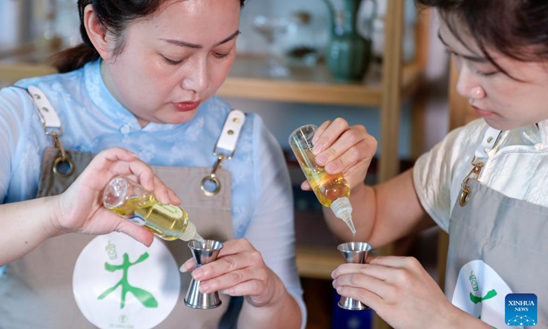 Wang Sun (L) gives instructions to her apprentice at Demingshe, a tea art vocational training school in Huangshan City, east China's Anhui Province, May 23, 2024. (Photo: Xinhua)