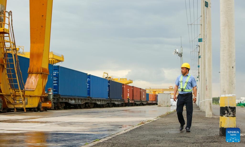 This photo taken on May 14, 2023 shows Hamit Turgun patrolling the Horgos railway port in Horgos, northwest China's Xinjiang Uygur Autonomous Region. (Photo: Xinhua)