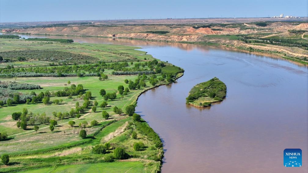 An aerial drone photo taken on May 30, 2024 shows a section of the Yellow River in Yinchuan, northwest China's Ningxia Hui Autonomous Region. The Yellow River, China's second-largest river after the Yangtze, is dubbed the mother river. In recent years, continued efforts have been made to protect its ecology, as vitality has returned to the Yellow River basin in Ningxia.(Photo: Xinhua)