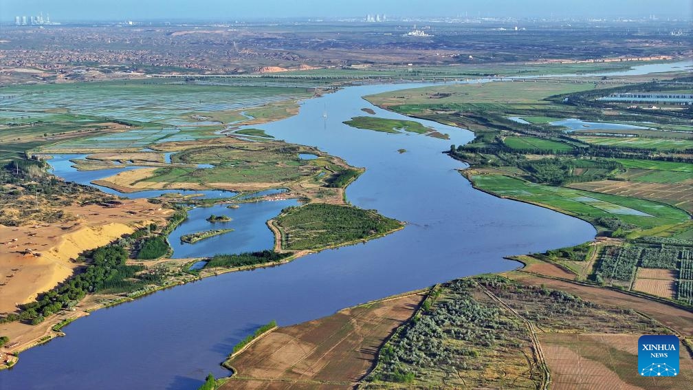 An aerial drone photo taken on May 30, 2024 shows a section of the Yellow River in Yinchuan, northwest China's Ningxia Hui Autonomous Region. The Yellow River, China's second-largest river after the Yangtze, is dubbed the mother river. In recent years, continued efforts have been made to protect its ecology, as vitality has returned to the Yellow River basin in Ningxia.(Photo: Xinhua)