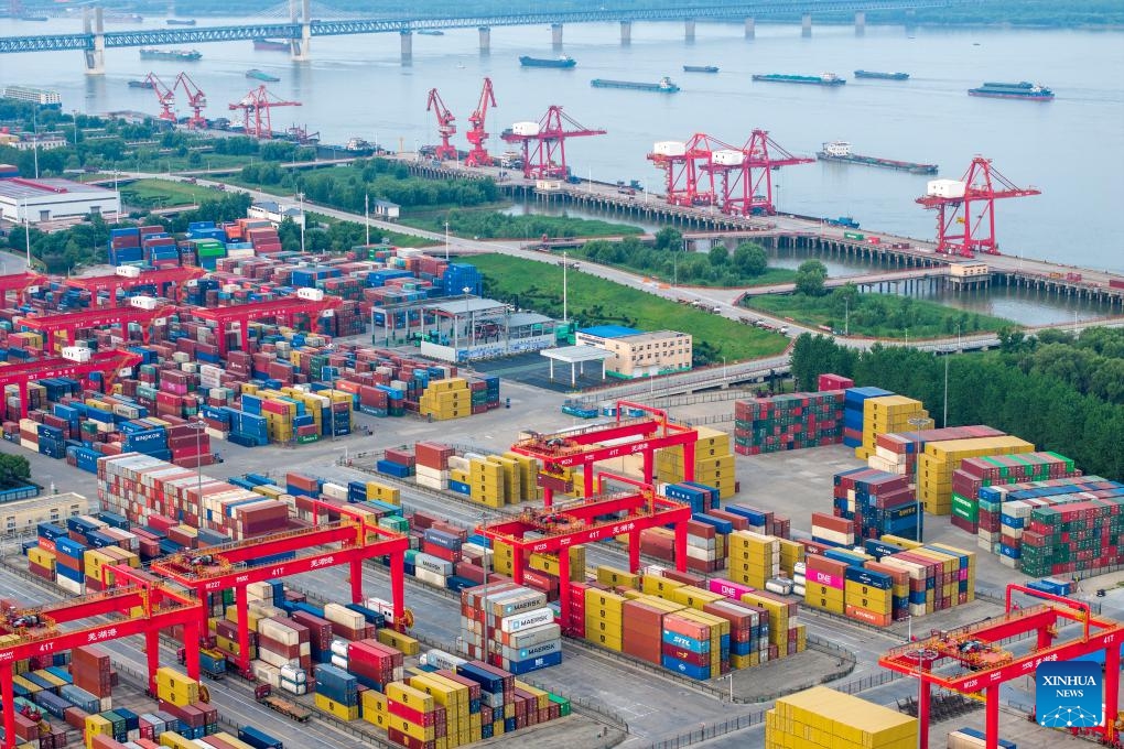 An aerial drone photo taken on May 26, 2024 shows an international container terminal of Zhujiaqiao area at Wuhu Port in Wuhu City, east China's Anhui Province. Wuhu Port in east China's Anhui Province has witnessed rising cargo throughput so far this year, with a large number of containers and vehicles waiting for shipment.(Photo: Xinhua)