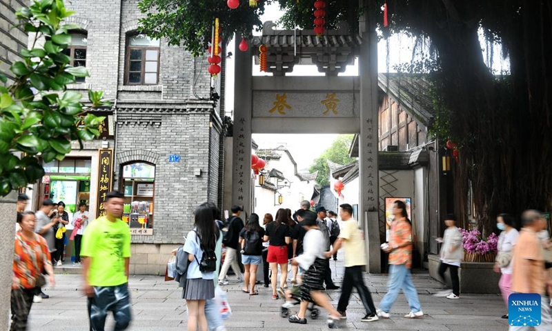 Tourists visit a street in the ancient Sanfangqixiang (Three Lanes and Seven Alleys) area in Fuzhou, southeast China's Fujian Province, June 7, 2024.