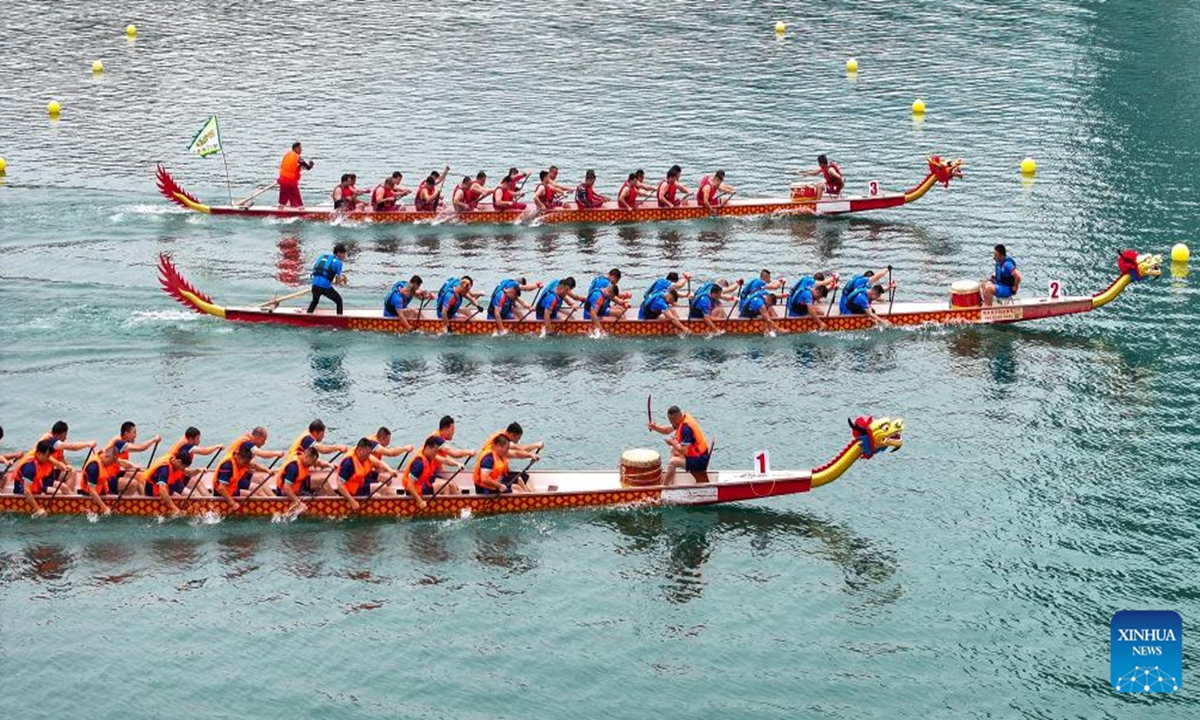 An aerial drone photo taken on June 8, 2024 shows teams competing during a dragon boat race in Zixing City, central China's Hunan Province. To celebrate the upcoming Duanwu, or the Dragon Boat Festival, dragon boat races were held in many places in China. The festival is celebrated on the fifth day of the fifth month on the Chinese lunar calendar to commemorate ancient Chinese poet Qu Yuan from the Warring States Period (475-221 B.C.). (Photo by Guo Liliang/Xinhua)

