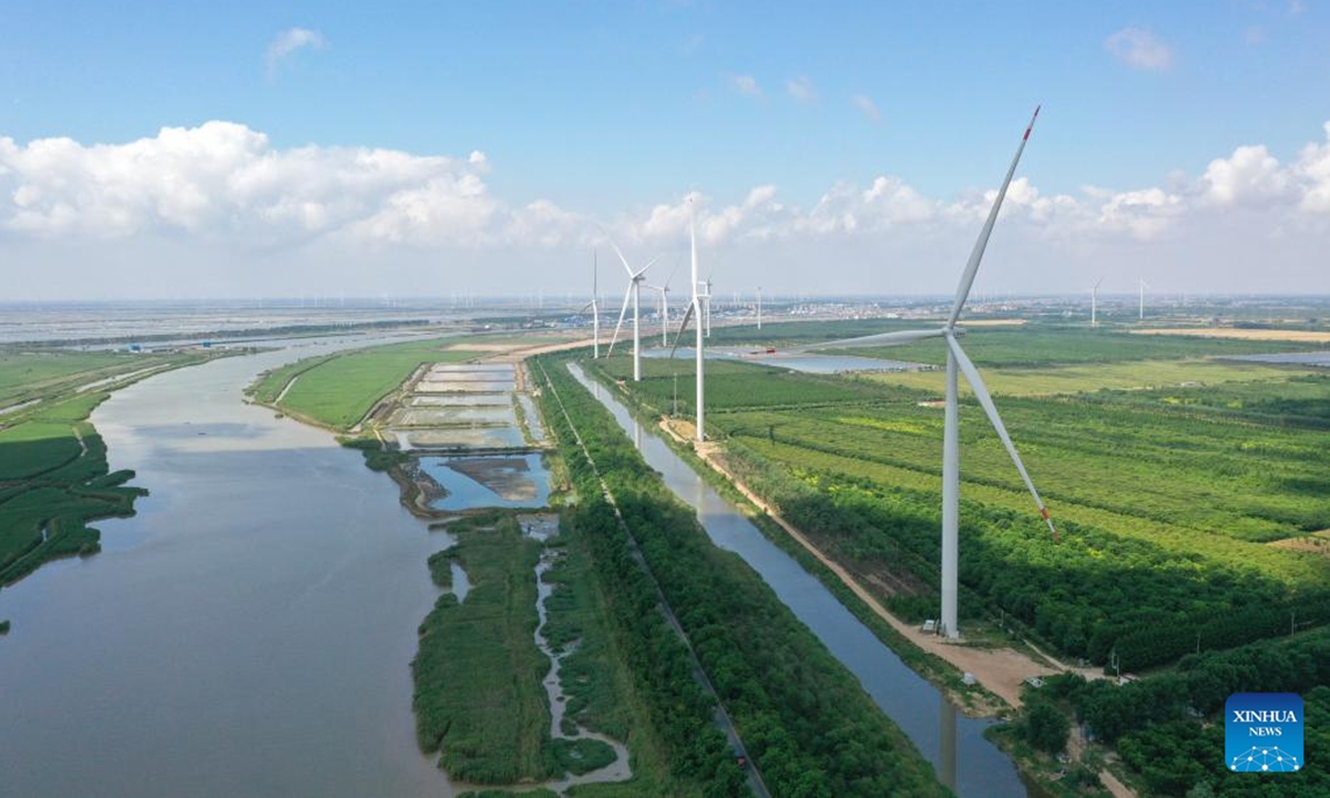 An aerial drone photo taken on June 6, 2024 shows the wind power equipment at a low(zero) carbon-dioxide emission industrial park in Sheyang, Yancheng, east China's Jiangsu Province. Yancheng, situated on the Yellow Sea coast, boasts the longest coastline and largest sea area of east China's Jiangsu Province.


