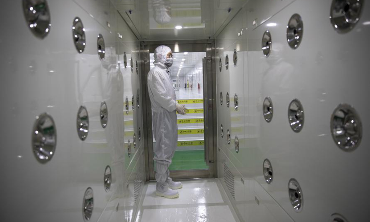 Yang Jian prepares to enter the workshop in the headquarters of TankeBlue Semiconductor Co., Ltd. in Daxing District of Beijing, capital of China, Jan. 24, 2024. (Xinhua/Jin Liwang)
