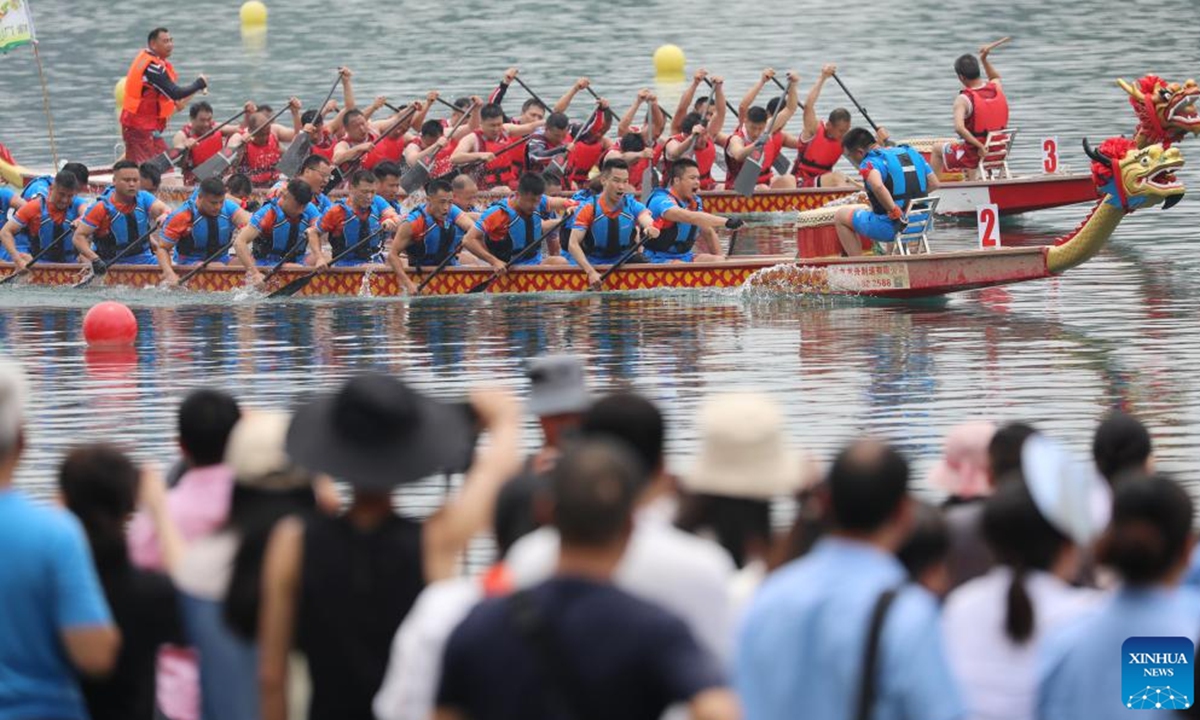 Teams compete during a dragon boat race in Zixing City, central China's Hunan Province, June 8, 2024. To celebrate the upcoming Duanwu, or the Dragon Boat Festival, dragon boat races were held in many places in China. The festival is celebrated on the fifth day of the fifth month on the Chinese lunar calendar to commemorate ancient Chinese poet Qu Yuan from the Warring States Period (475-221 B.C.). (Photo by Zhu Xiaorong/Xinhua)

