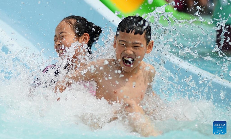 Children play at a water park in Tengzhou, east China's Shandong Province, June 9, 2024. People enjoy the 3-day holiday of the Dragon Boat Festival, also called Duanwu Festival, which falls on June 10 this year, via various activities across the country. (Photo: Xinhua)